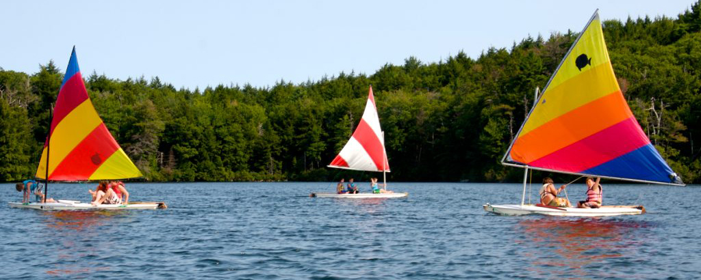 Overnight campers at YMCA Camp Hi-Rock sail on our beautiful Plantain Pond.